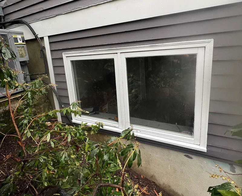 Basement double casement window in a Norwalk, CT condo