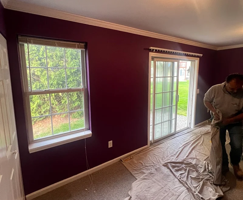 Old double hung window and sliding patio door in a Danbury condo