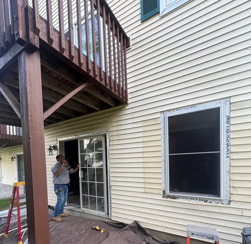 Window Solutions Plus installing a window and patio door in Danbury, CT