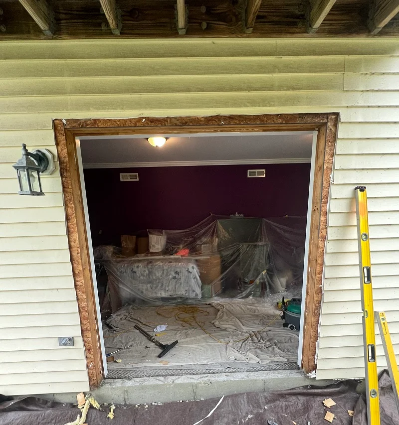 A Window Solutions Plus master carpenter installing gliding patio door in Danbury