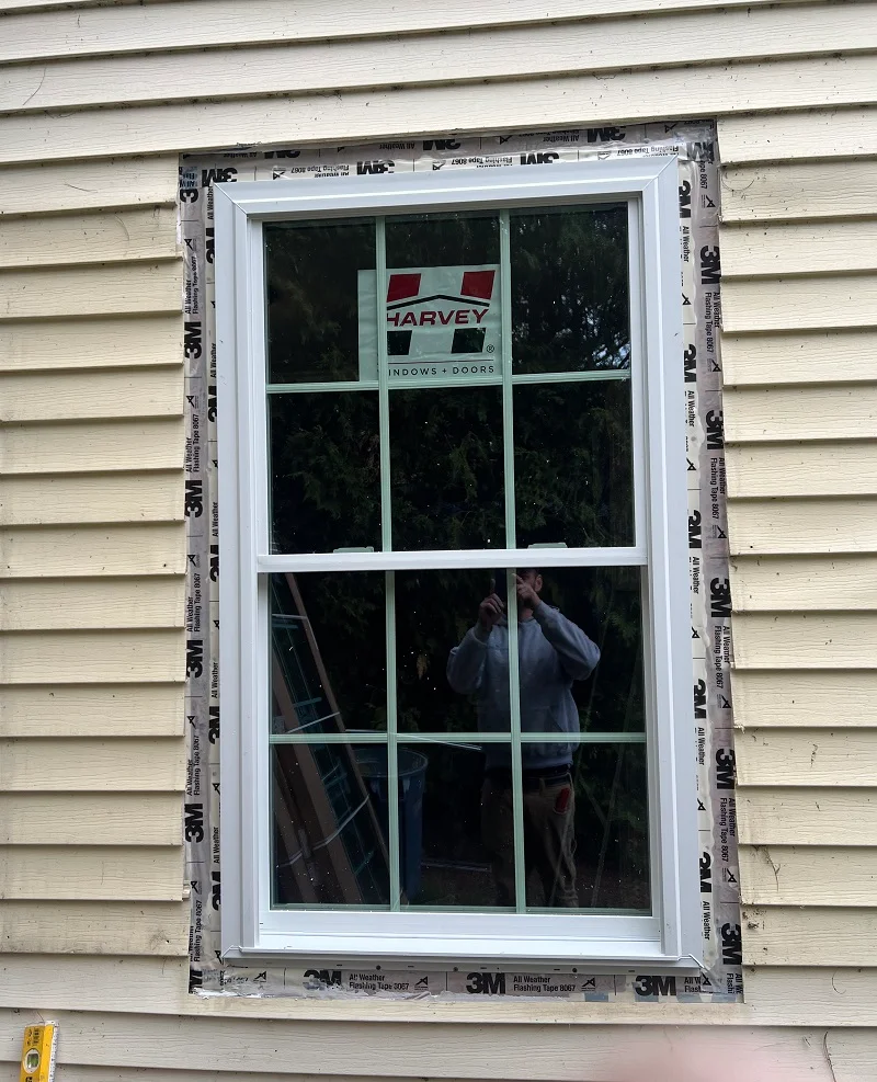 A new construction Harvey window properly flashed with 3M all weather flashing tape