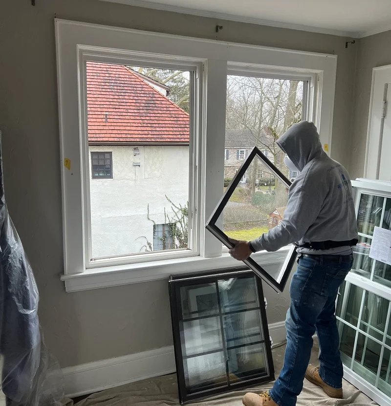Taking out the old double hung window sashes