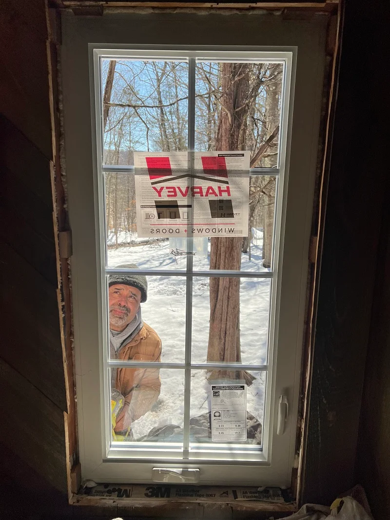 Harvey vinyl casement window being installed in Newtown, CT